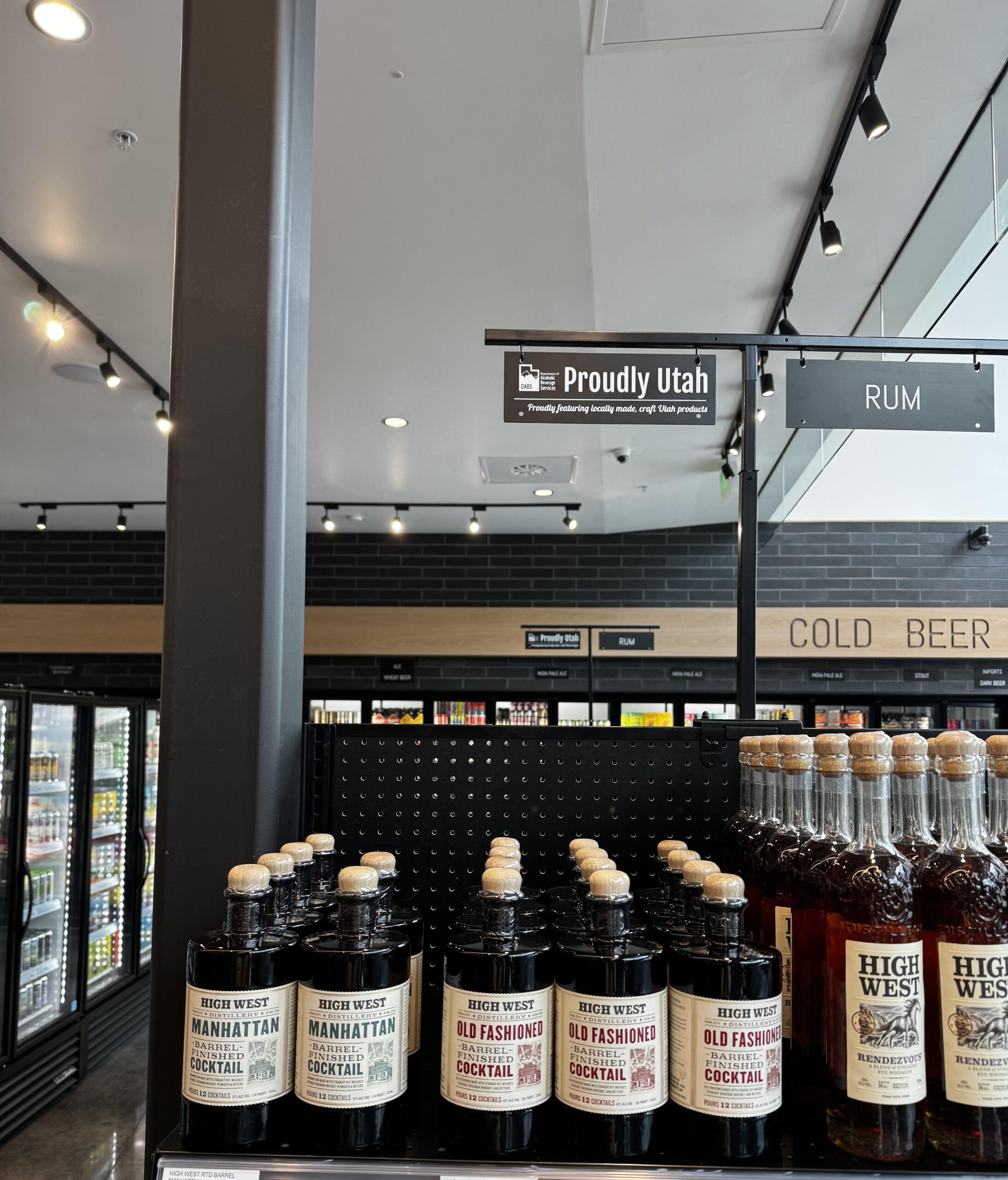 Proudly Utah sign above bottles of High West liquor bottles