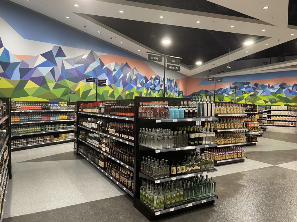 wide shot of alcohol products on shelves inside new East Sandy store