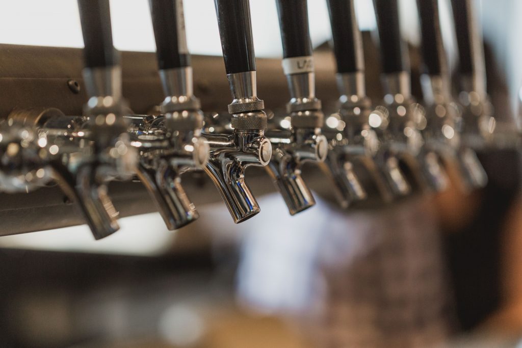 Close-up image of beer taps