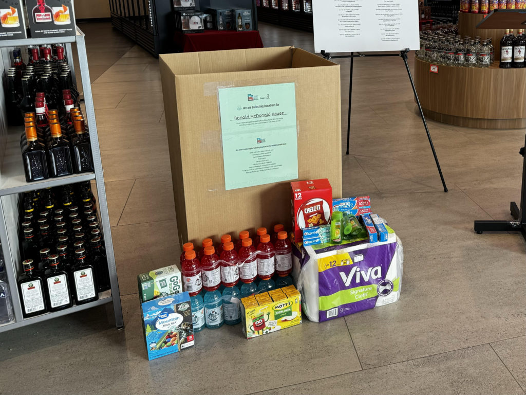 Donation box at DABS liquor store #3 in Salt Lake City with donation items
